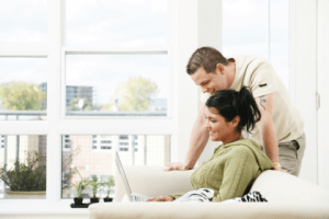 Couple discussing window glass replacement prices